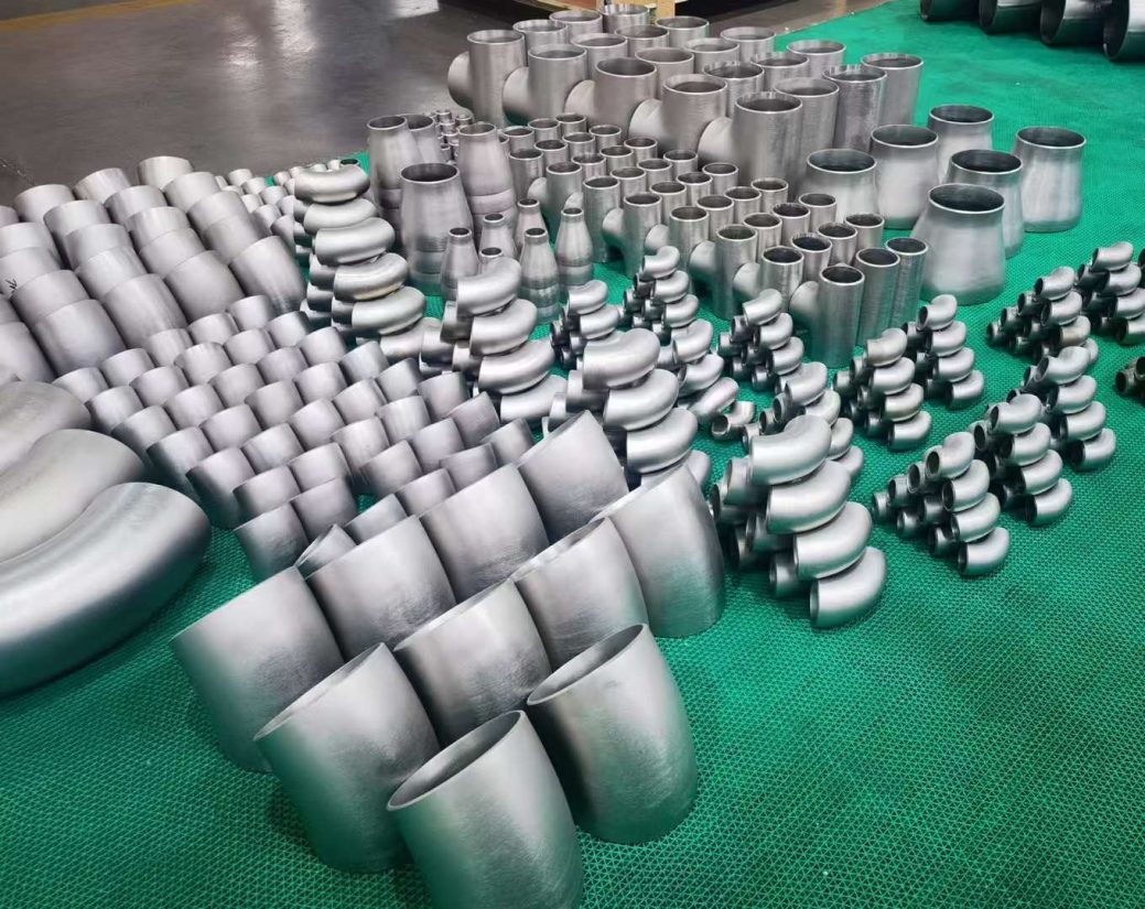 Titanium pipe fittings